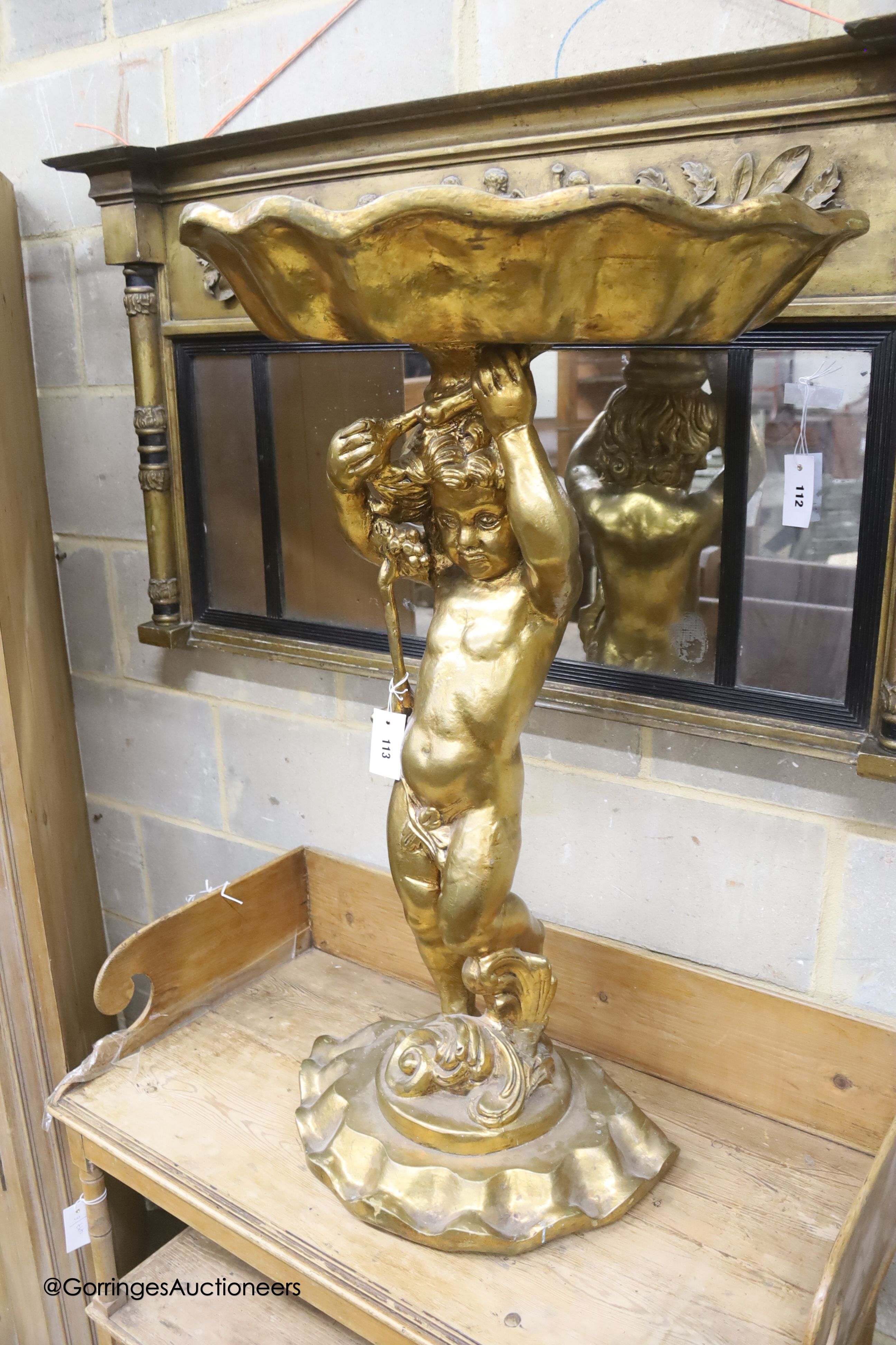 A gilt composition cherub and shell table, height 98cm